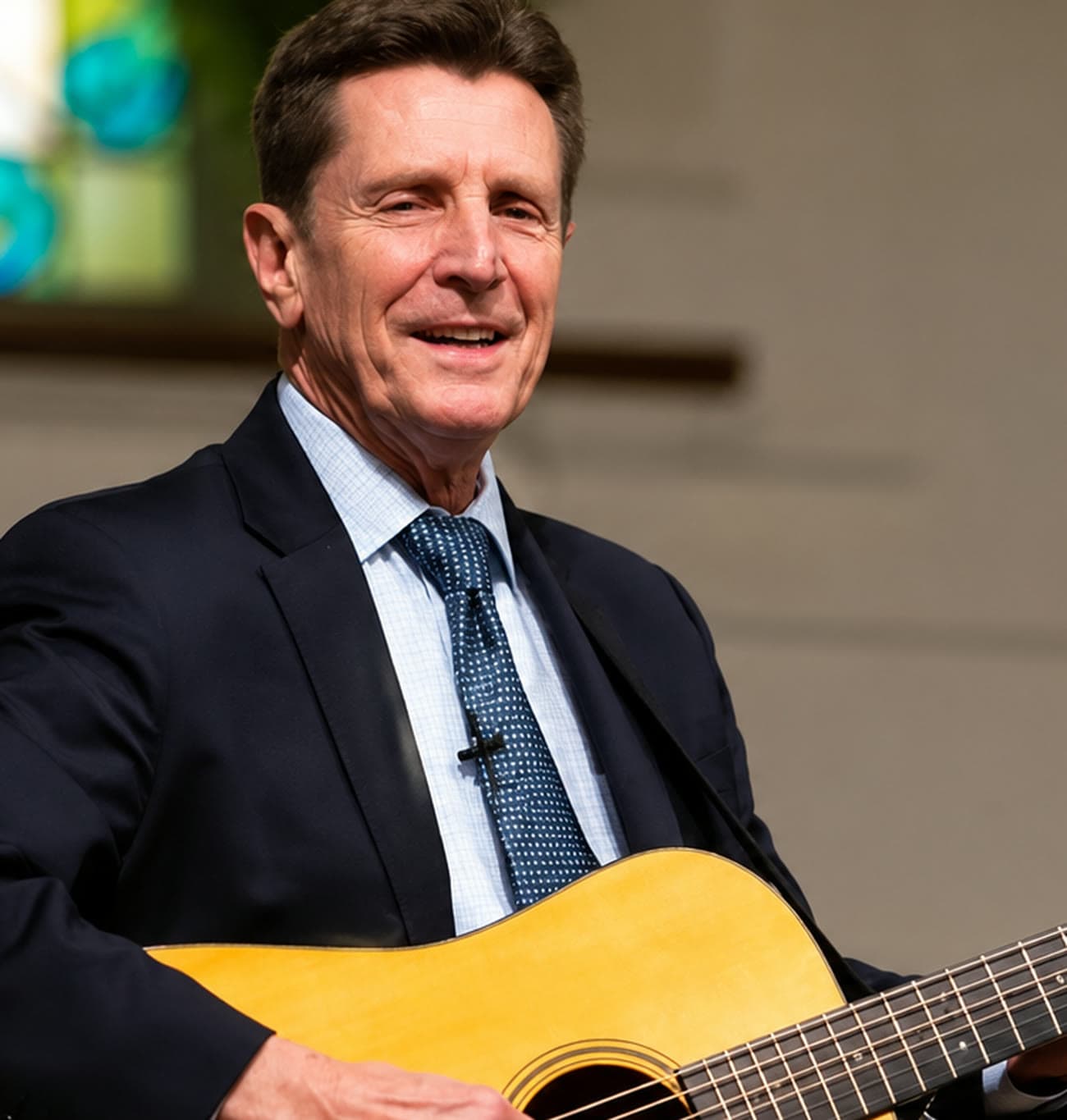 Bruce Frye playing guitar and singing