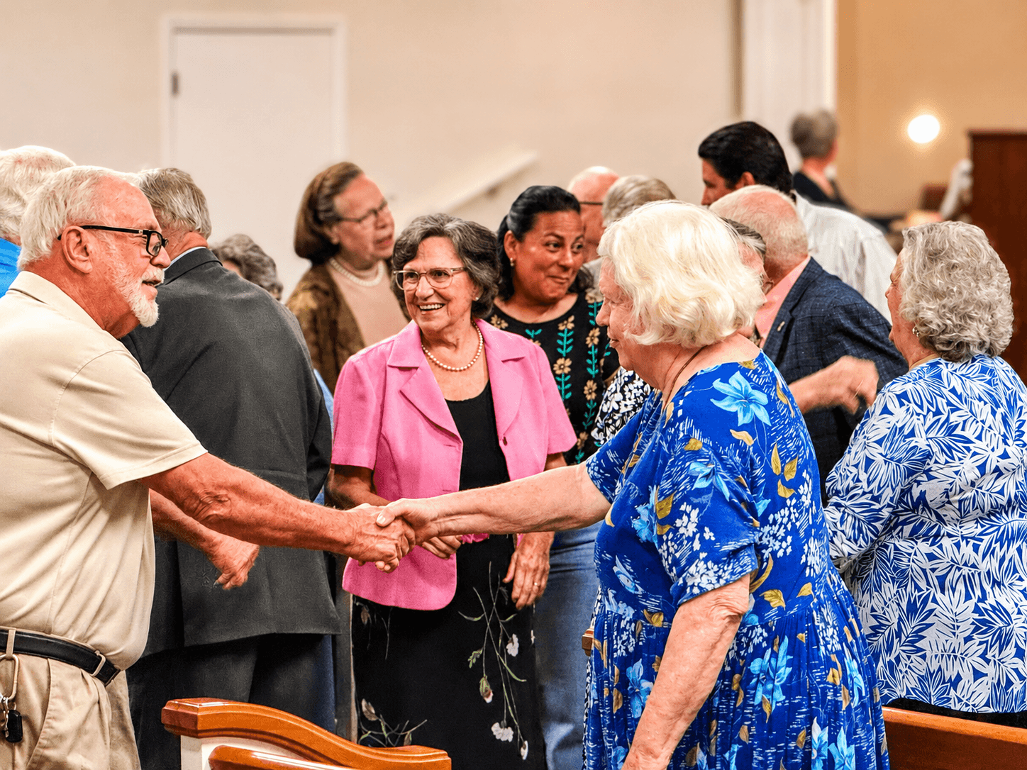 Members of Open Door Baptist Church greeting one another before the morning service