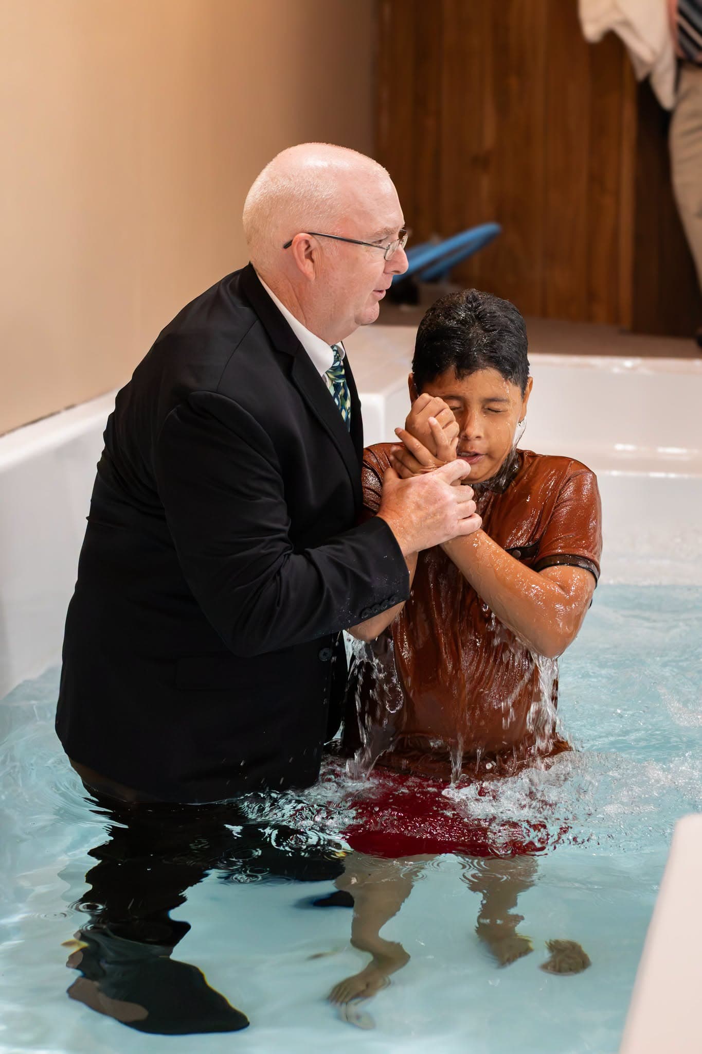 Pastor Weaver baptizing a new believer